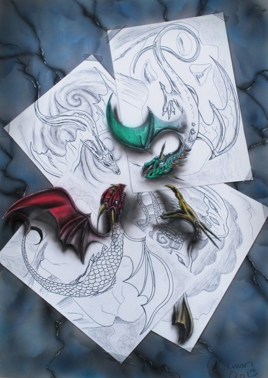 dibujos en hojas de papel que forman unos dragones en 3D 