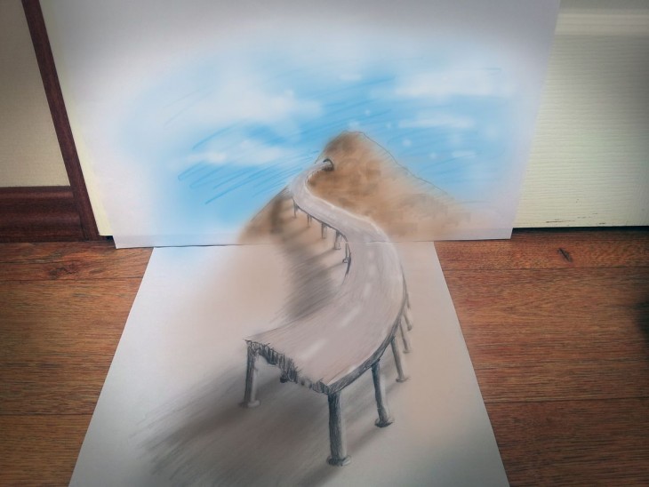 dibujo en 3D sobre una hoja de papel que muestra una carretera 