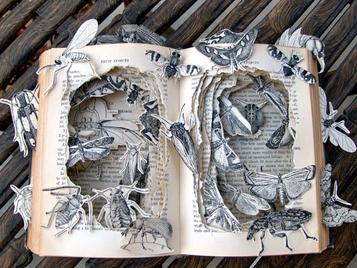 libro hecho arte con insectos que salen de el libro