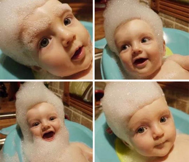 Imagen de un bebé con jabón espuma de jabón sobre la cabeza 