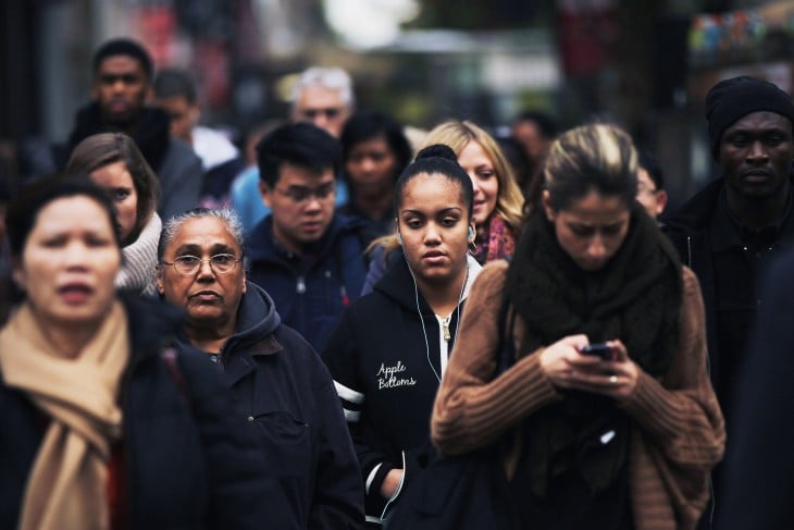 NEW YORK, NY - OCTOBER 31: A crowd of people wait to cross the street in midtown Manhattan on October 31, 2011 in New York City. Around the world countries marked the global population reaching seven billion Monday. The UN is using Monday to symbolically mark the day as demographers are not sure exactly when the world's population will reach the seven billion mark. (Photo by Spencer Platt/Getty Images)