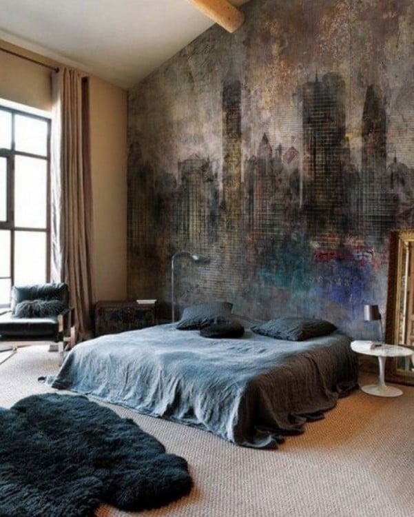 habitación con una cama y un mural de unos edificios en colores oscuros 
