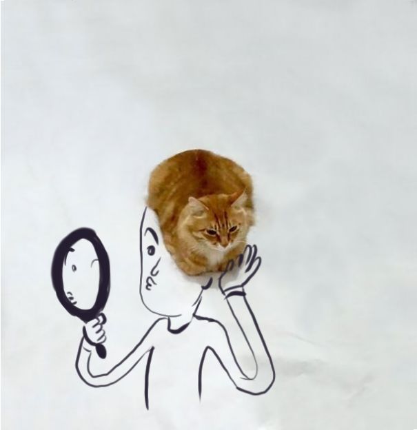 Gato sobre un dibujo de una persona donde simula ser su cabello 