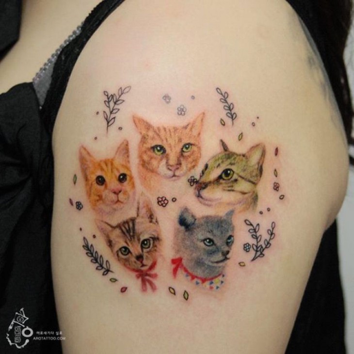 tatuaje acuarela con el diseño de las caras de unos gatos 