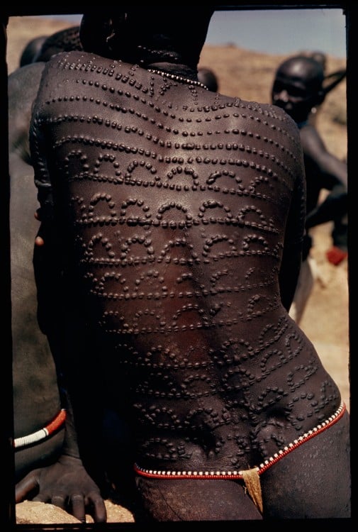 Welts, scars of beauty, pattern the entire back of a Nuba woman in Sudan, 1966.