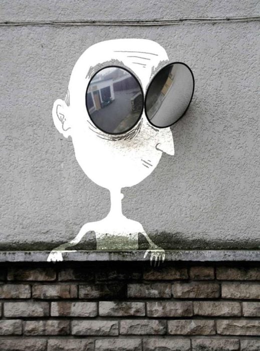 Arte en las calles de París - hombre con lents