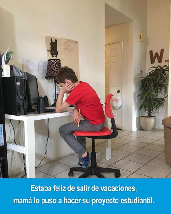 niño sentado en un escritorio