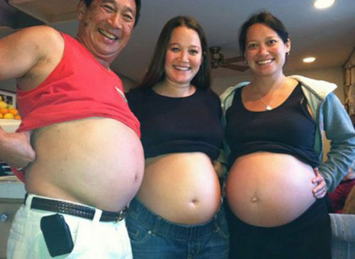 tres personas mostrando su voluminosa panza 