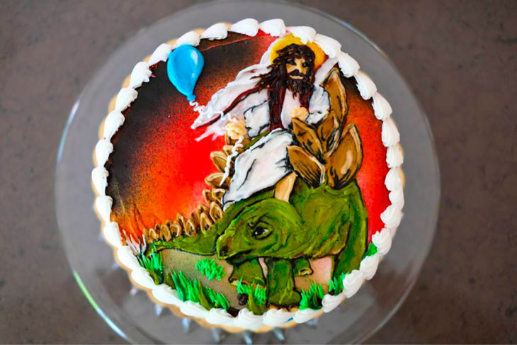 pastel de jesús montado en un dinosaurio 