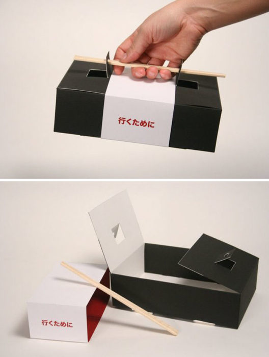 Caja de sushi con palillos como empuñadura